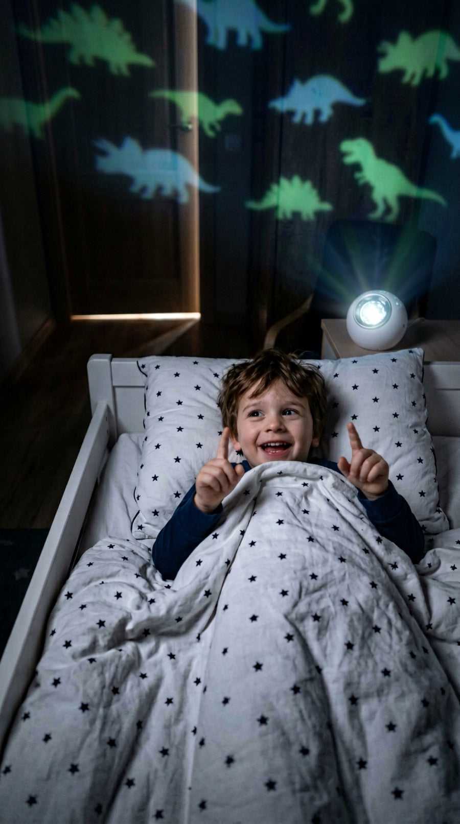 Toddler smiling at the dinosaur projection
